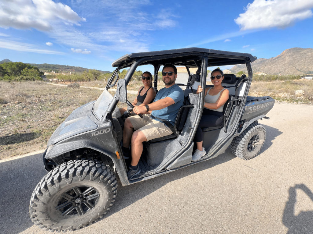Guests enjoying a guided Segway U10 off-road buggy tour near Finca Moñino, with mountain views in the Alicante and Murcia countryside.